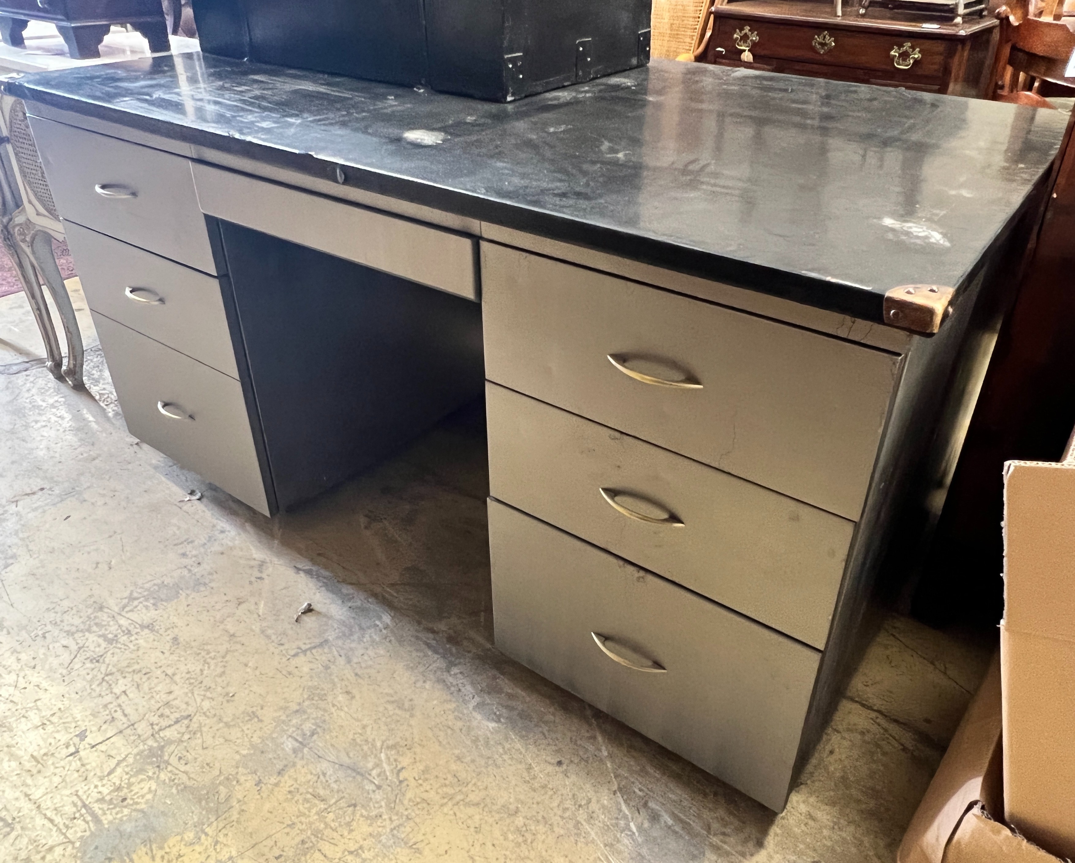 An industrial style grey metal kneehole desk, length 152cm, depth 91cm, height 78cm